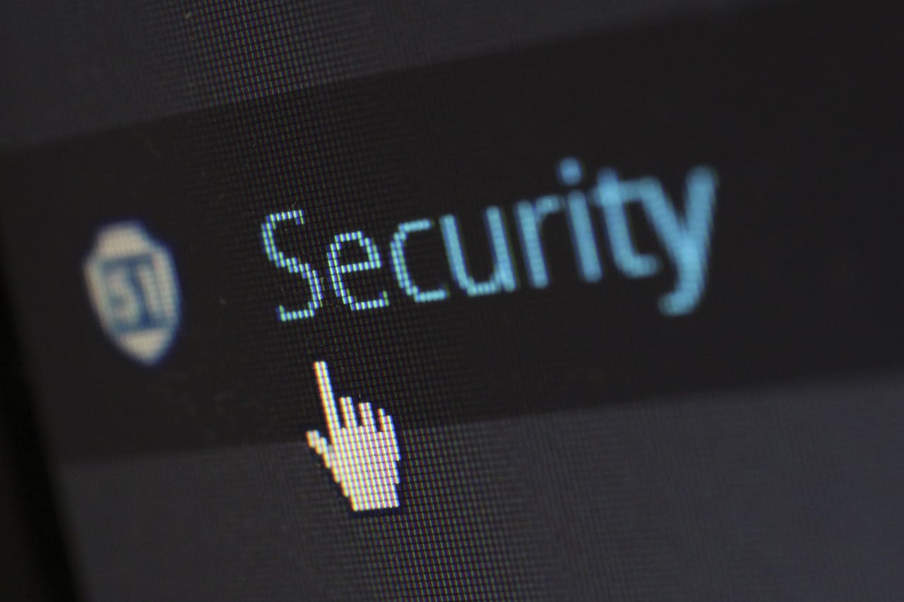 Crafting Captivating Headlines: Your awesome post title goes here Close-up view of a mouse cursor over digital security text on display.